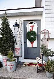 Spacious porches need large displays, and this towering display will look stately on a sizeable christmas firewood bucket. 28 Wonderful Christmas Decorating Ideas For Magical Outdoor Spaces