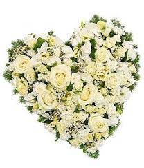 She provides high quality, contemporary funeral flowers and floral tributes at affordable prices. White Rose Heart Mad Lilies Banstead Surrey