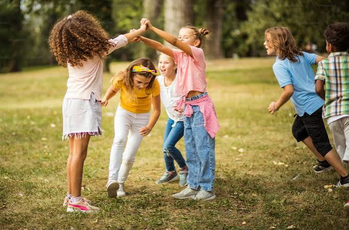 Large group of school kids having fun in nature. - Photo on Unsplash+