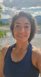 Dog playing in water with papa