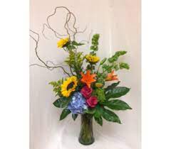 Edwards floral design has a huge assortment of all types of flowers such as roses, plants, and popular seasonal flowers. Splash Of Color In Mckinney Tx Edwards Floral Design Church Flower Arrangements Fall Flowers Flower Delivery