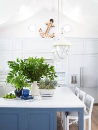 Coastal farmhouse kitchens make use of plenty of bright whites and reclaimed woods, apron style sinks and lantern pendant lights. Blue Kitchen Island Cottage Kitchen Pratt And Lambert Symphony Blue Coastal Living