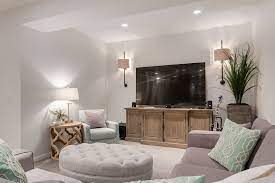 Wall sconces next to tv. Family Room Basement Restoration Hardware Tufted Ottoman Wall Sconces By Decoratinglife Ca Wall Sconces Living Room Living Room Loft Cozy Basement