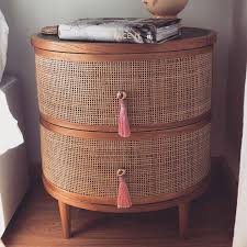 It has bamboo drawer pulls. Add A Natural Touch To Your Home With This Double Drawer Bedside Table Made From Mindi Wood Wi Pink Bedside Tables Bedside Table Decor Furniture Bedside Table