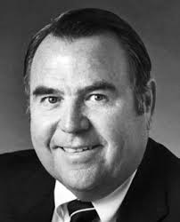 the “Legal Eagles” football team while in law school. McElroy was a  lifelong supporter of KUT radio. He is survived by his s