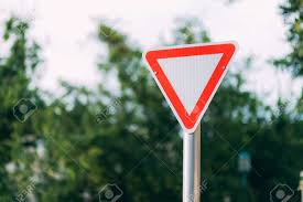 We did not find results for: Sign Give Way On A Blurred Street And White Sky Red And White Road Sign In