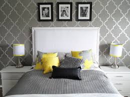 Black border bedding and black monogrammed shams complement a mustard yellow velvet wingback bed placed against a wall clad in fornasetti nuvole. Grey And Yellow Bedroom Wallpaper Room Yellow Furniture Bedroom Wall 523825 Wallpaperuse