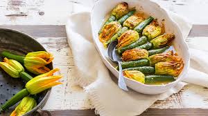 Zucchini plant leaves grow so large that they can often shade the plant itself and reduce sunlight to itself or surrounding plants. Zucchini Flowers Stuffed With Herbs And Rice Recipe Sbs Food