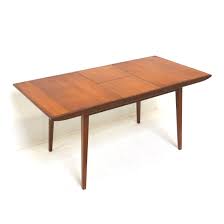 Kitchen tables our retro kitchen tables, in a variety of shapes and sizes, all come with a 2.25 grooved shiny aluminum edge and can be customized with dozens of laminates to match your retro kitchen decor.: Vintage 60s Extendable Dining Table By Louis Van Teeffelen For Webe 168674