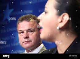 Kenneth Deane, EUPOL COPPS (European Union Co-ordinating Office for  Palestinian Police Support) Head of Mission, left, looks at Eman Jamoos of  the Palestinian High Judicial Council, as she addresses the media on
