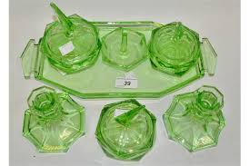 We did not find results for: An Art Deco Green Glass Dressing Table Set Comprising Of Candlesticks Powder Bowls And Covers R