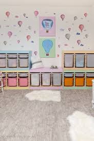 If toys all have a home, kids will be better able to help with cleanup (green bin for cars, red bin for dolls, orange bin for play food, etc). Kids Playroom Makeover With Hot Air Balloons So Much Better With Age