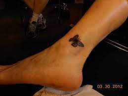34 Charming Ankle Butterfly Tattoos And Designs Butterfly Ankle Tattoos Butterfly Tattoo Ankle Tattoo Designs