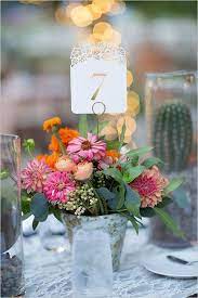30 Ways To Use Buckets At Your Wedding Wedding Table Mexican Wedding Centerpieces Flower Centerpieces Wedding