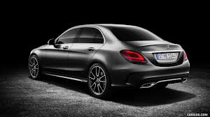 A race that knows no finish line. 2019 Mercedes Benz C Class Sedan Amg Line Color Platinum White Pearl Black Rear Three Quarter Hd Wallpaper 2