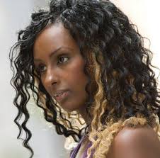 Reddish orange on her curly ringlets looking like jewel embellishment on each curl. Hair Highlights Gallery Lovetoknow