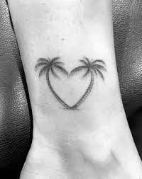 Palm Tree Tattoo Meaning Tattooswin Palm Tattoos Tree Heart Tattoo Trendy Tattoos