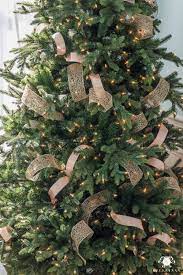You'll need a longer piece of ribbon and a couple of bids. How To Decorate A Christmas Tree With Ribbon Kelley Nan