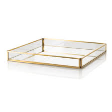 The most common gold mirror tray material is metal. Gold Glass Mirrored Tray Oliver Bonas