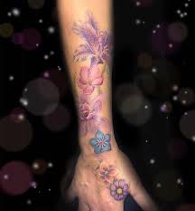 Megan Rosenoirtattoo On Instagram Some Soft Colored Delicate Flowers Done By Megan Wood Using Machine Cheye Megan Woods Watercolor Tattoo Tattoos