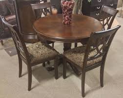 The Leahlyn 5 Piece Cherry Finish Round Dining Table Set Bookmatched Birch Veneer With A Round Dining Table Sets Furniture Dining Table Dining Table Setting