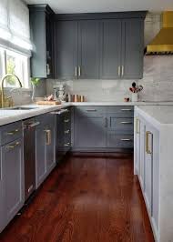 Stunning Gray Kitchen With Gold Accents Boasts Cherry Stained Oak Wood Floors Lining Gray Cherry Wood Kitchen Cabinets Wood Floor Kitchen Cherry Wood Kitchens