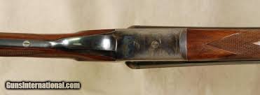 Double platinum double jaw set, articulated trigger, gas exhaust valves, selective automatic ejectors, fine etchings as illustrated by models. Ugartechea Model 30 Grade I 12 Gauge 26 Bbls