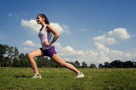 Woman Stretching | Free Stock Photo | A young woman stretching outdoors  before exercising | # 15250