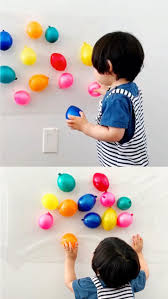 Sticky Wall Balloon Sensory Activity For Babies And Toddlers Great Fine Motor Fine Motor Skills Activities Toddler Learning Activities Motor Skills Activities