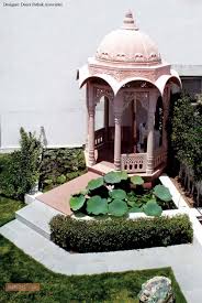 An Outdoor Puja Room Styled In Dome Shape Painted In Light Colour Puja Room Mandir Design Pooja Rooms