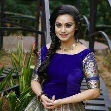 Come here, come here, leave your door a crack, the time has come to summon them back! 20 Lakshmi Nakshathra Ideas Star Magic Television Anchor Saree Hairstyles
