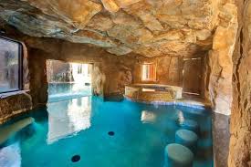 The Grotto Behind The Waterfall With Spa Swim Up Bar And Access To The Grotto Lounge Indoor Swimming Pools Swimming Pool Designs Dream Pools