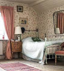An Upstairs Attic Bedroom Transformed With Soft Pastel Wallpaper And A Pastel Blue Green Iron Bed Simple Dec Cottage Interiors Cottage Bedroom Country Bedroom