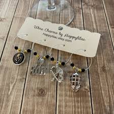 These two glasses feature the logo of your favorite nhl team and are the perfect addition to any hockey fan's barware collection. Hockey Wine Charm Vegas Golden Knights Golden Knights Wine Etsy Wine Charms Wine Glass Charms Vegas Golden Knights