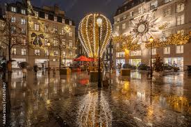 Paris, France - 12 22 2022: View of facades of Christian Dior Paris and  Coco Chanel with christmas decoration in a rainy night Stock Photo | Adobe  Stock
