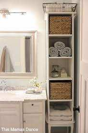 The linen storage cabinet with 4 interior shelves, 1 drawer and a glass door.the bathroom storage cabinet top glass door and bottom both are have adjustable partition. Tall White Cottage Cabinet Diy Bathroom Towel Storage Cottage Cabinet Diy Bathroom Storage