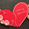 Glue the red heart to the middle of the card. 1