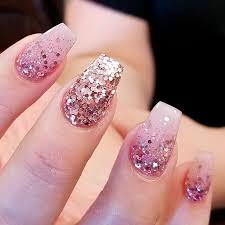 Pastel Pink Nails With Gold Glitter Nail And Manicure Trends The nails are light pink with two accent nails.