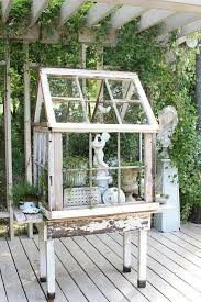 Electric drill (used as a screwdriver) 20 Repurposed Old Window Ideas To Add Charm To Your Home The Art In Life Diy Greenhouse Small Greenhouse Window Greenhouse