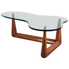 The mass produced coffee table noguchi designed for herman miller appears to have evolved out the noguci table was introduced in 1945 and produced until 1973. T H Robsjohn Gibbings Biomorphic Glass Coffee Table For Sale At 1stdibs