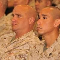 U.S. Marine Corps Master Sgt. Cyrus S. Nator, left,