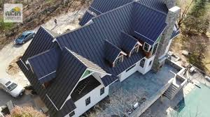 The right color says even more. Sudbury Ma Dark Bronze Standing Seam Metal Roof Dave Youtube