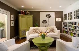 Green And Brown Living Room Features Walls Painted Green Lined With A A Large Gray And Blue Brown And Green Living Room Living Room Turquoise Living Room Green
