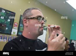 Rapper James Wade Tries Out His New Rolling Papers By Smokers Choice For  His "Medicated & Motivated EP" Hosted by Snoop Lion Stock Photo