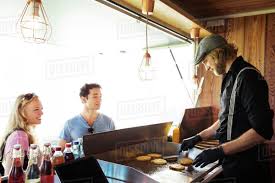 The editors of easy home cooking magazine a. Cook In Food Truck Serving Customers Innsbruck Tirol Austria Stock Photo Dissolve