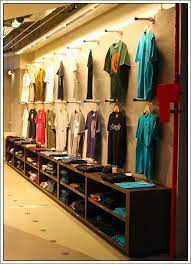 The store will not work correctly in the case when cookies are disabled. Do It Yourself T Shirt Faceouts Line The Wall Fixtures Close Up Clothing Store Design Clothing Store Displays Wall Mounted Clothing Rack