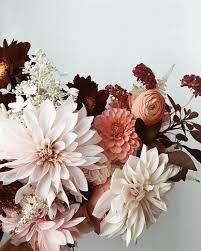 Combined vibrant blooms (like ranunculus and dahlias) with textured grasses and crawling vines. Peach Maroon And Mauve Palette For A Fall Harvest Wedding Bouquet Garden Wedding Gardenwedding Pretty Flowers Flower Arrangements Flowers