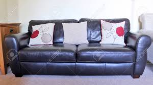 Many of the following living rooms use leather furniture as an accent, rather than as a focal point, but you'll see all the ways and styles that make leather an excellent choice for your next living room set! Two Seater Black Leather Sofa With Red Cushions Stock Photo Picture And Royalty Free Image Image 115865223