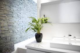This bathroom design takes that atmosphere a step further by adding an accent wall of natural stone veneer behind the tub. Bathroom Stone Cladding Norstone Uk Stone Cladding Experts