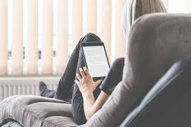Young Woman Reading Ebooks On Her Ipad Tablet Free Stock Photo How To Stay Motivated Self Development Self Help Books